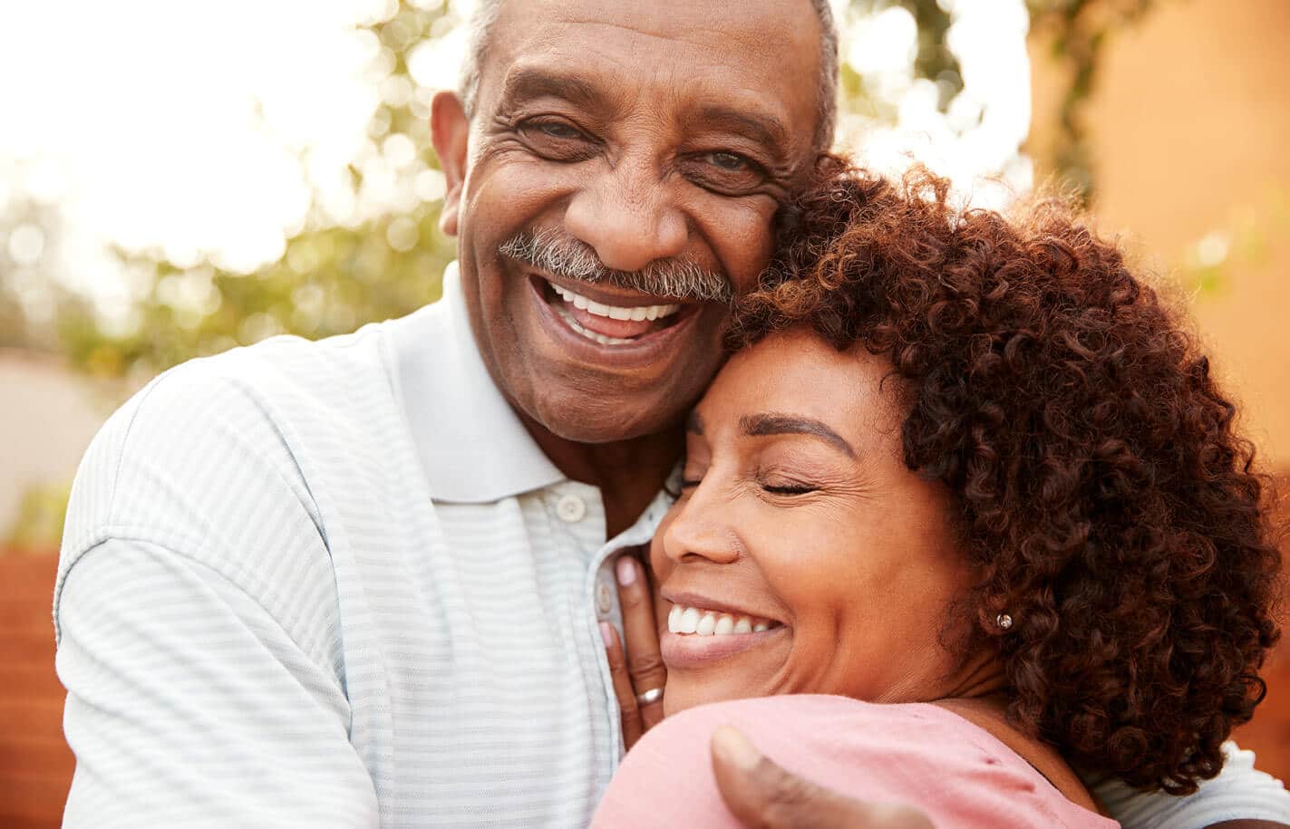 Senior Living couple embracing outdoors